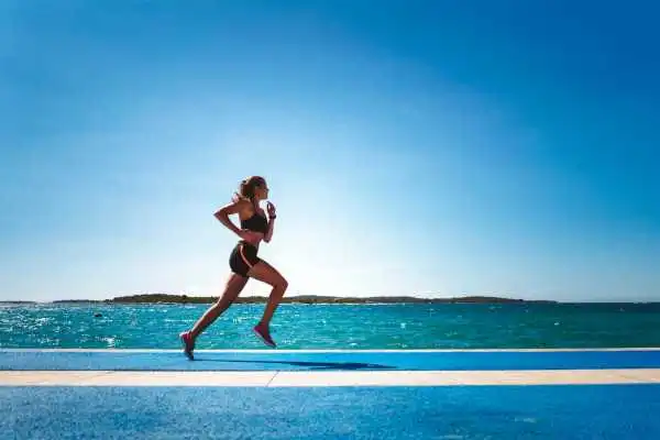 Woman running showing strong leg muscle Skelmersdale